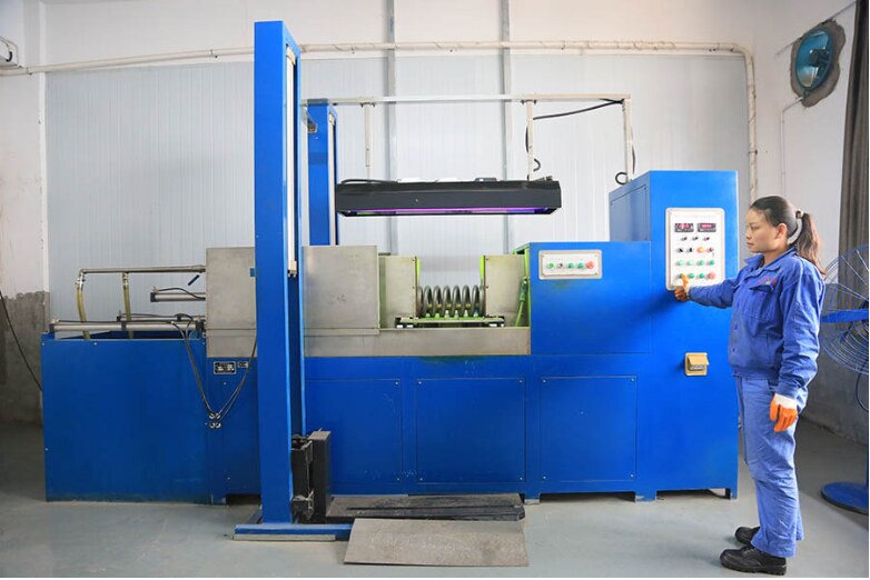 Spring load testing equipment operated by a NorenSpring technician